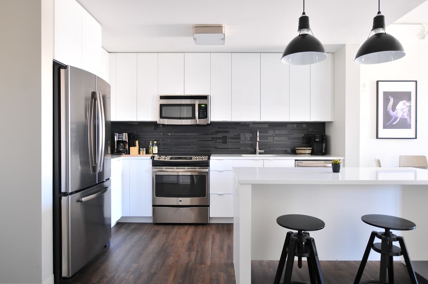 Renovated white kitchen with island seating